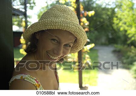 portrait of smiling woman with straw hat on veranda View Large Photo Image Stock Image - portrait of smiling woman with straw hat on veranda. Fotosearch