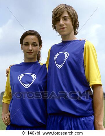 portrait of teenage boy and girl wearing football dresses View Large Photo Image Stock Image - portrait of teenage boy and girl wearing football dresses. Fotosearch