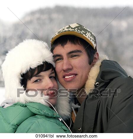 Stock Image - portrait of teenage couple in winter clothes. Fotosearch