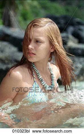 portrait of teenage girl (16-19 years) in bikini sitting in the water View Large Photo Image Stock Image - portrait of teenage girl (16-19 years) in bikini sitting in the water. Fotosearch