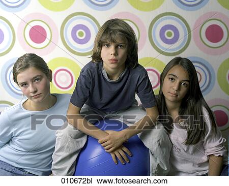 portrait of three children in front of colourful wallpaper View Large Photo Image Stock Image - portrait of three children in front of colourful wallpaper. Fotosearch