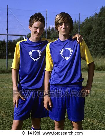 portrait of two friends in football dress View Large Photo Image Stock Image - portrait of two friends in football dress. Fotosearch