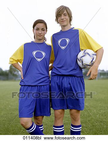 Stock Image - portrait of two teenagers in football dress. Fotosearch