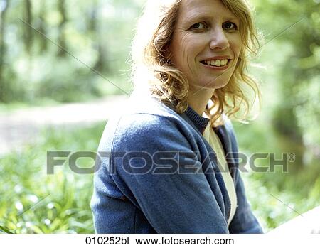 portrait of woman (35-40 years) smiling at camera View Large Photo Image Stock Image - portrait of woman (35-40 years) smiling at camera. Fotosearch
