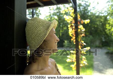 portrait of woman with straw hat on veranda View Large Photo Image Stock Image - portrait of woman with straw hat on veranda. Fotosearch
