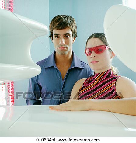 portrait of young couple surrounded by stylish objects View Large Photo Image Stock Image - portrait of young couple surrounded by stylish objects. Fotosearch