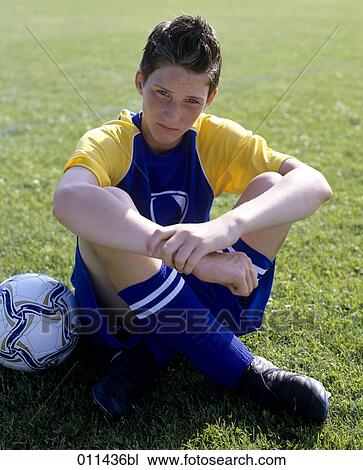 portrait of young football player with serious expression View Large Photo Image Stock Image - portrait of young football player with serious expression. Fotosearch
