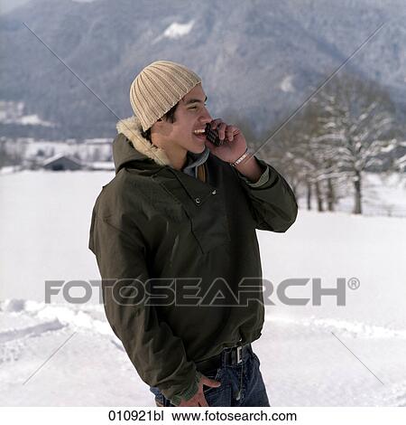 portrait of young male teenager talking on his cellphone View Large Photo Image Stock Image - portrait of young male teenager talking on his cellphone. Fotosearch