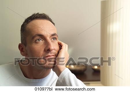 Portrait of young man in white jumper View Large Photo Image Stock Image - Portrait of young man in white jumper. Fotosearch
