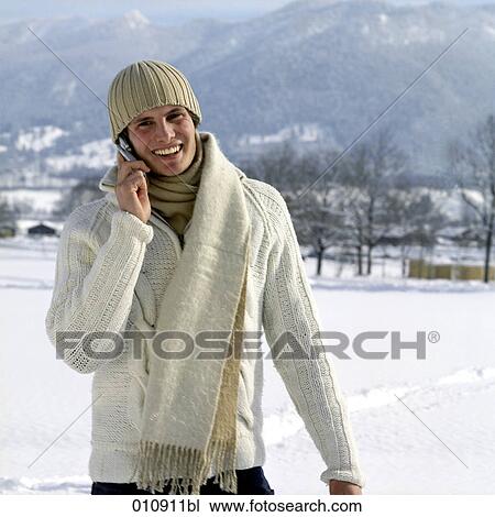 portrait of young man in winter clothes with cellular phone View Large Photo Image Stock Image - portrait of young man in winter clothes with cellular phone. Fotosearch