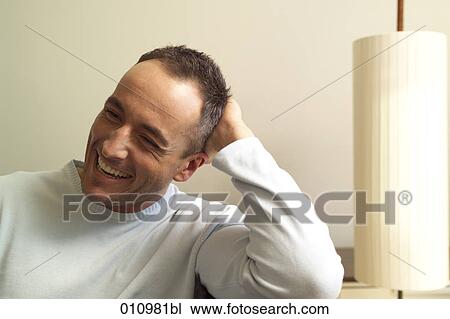 Portrait of young man laughing View Large Photo Image Stock Image - Portrait of young man laughing. Fotosearch