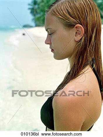 sad teenage girl on the beach View Large Photo Image Stock Image - sad teenage girl on the beach. Fotosearch