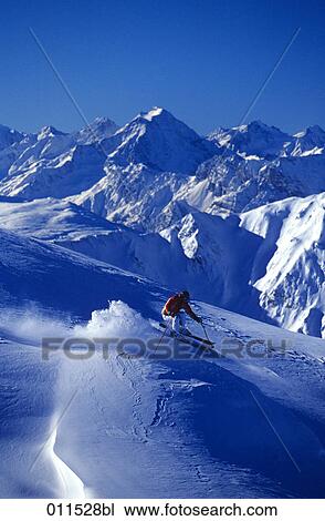 skier racing down mountain View Large Photo Image Stock Image - skier racing down mountain. Fotosearch
