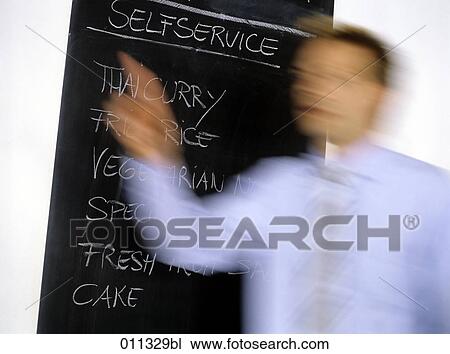 slate with menu of day in a restaurant, businessman with raised arm passing by View Large Photo Image Stock Image - slate with menu of day in a restaurant, businessman with raised arm passing by. Fotosearch