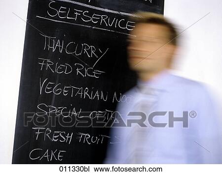 slate with menu of day in a restaurant, businessman in blue shirt walking by View Large Photo Image Stock Image - slate with menu of day in a restaurant, businessman in blue shirt walking by. Fotosearch