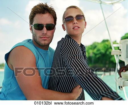 stylish couple posing on sailing boat in the Caribbeans View Large Photo Image Stock Image - stylish couple posing on sailing boat in the Caribbeans. Fotosearch