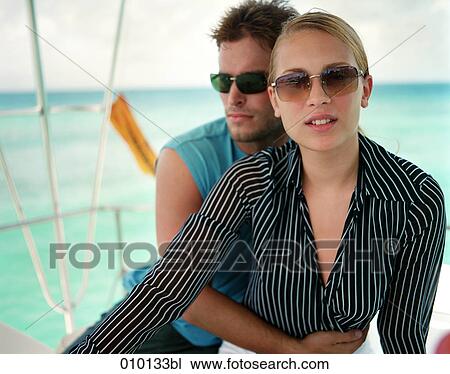 stylish couple posing on sailing boat in the Caribbeans View Large Photo Image Stock Image - stylish couple posing on sailing boat in the Caribbeans. Fotosearch