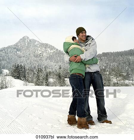 teenage couple enjoying a day out in the snow View Large Photo Image Stock Image - teenage couple enjoying a day out in the snow. Fotosearch