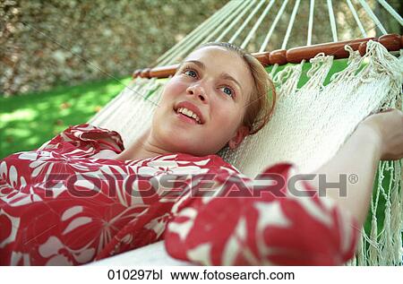 teenage girl (16-19 years) enjoying her time in a hammock View Large Photo Image Stock Image - teenage girl (16-19 years) enjoying her time in a hammock. Fotosearch