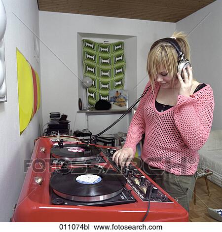 Teenage girl listening to record View Large Photo Image Stock Image - Teenage girl listening to record. Fotosearch