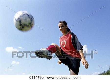 teenage girl shooting football View Large Photo Image Stock Image - teenage girl shooting football. Fotosearch