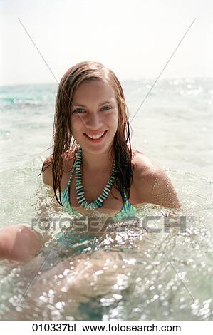 teenager (16-19 years) relaxing in the water View Large Photo Image Stock Image - teenager (16-19 years) relaxing in the water. Fotosearch