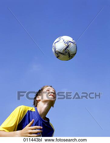 teenager exercising headers during football training View Large Photo Image Stock Image - teenager exercising headers during football training. Fotosearch