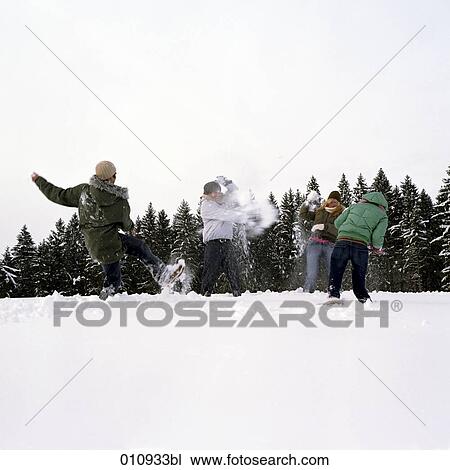 teenagers throwing snow balls at each other View Large Photo Image Stock Image - teenagers throwing snow balls at each other. Fotosearch