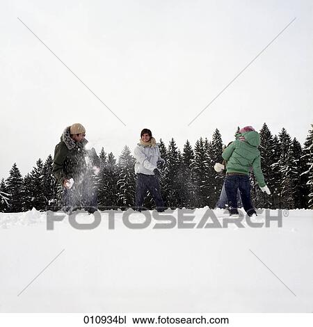 teenagers throwing snow balls at each other View Large Photo Image Stock Image - teenagers throwing snow balls at each other. Fotosearch
