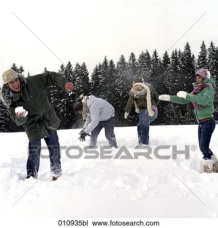 teenagers throwing snow balls at each other View Large Photo Image Stock Image - teenagers throwing snow balls at each other. Fotosearch