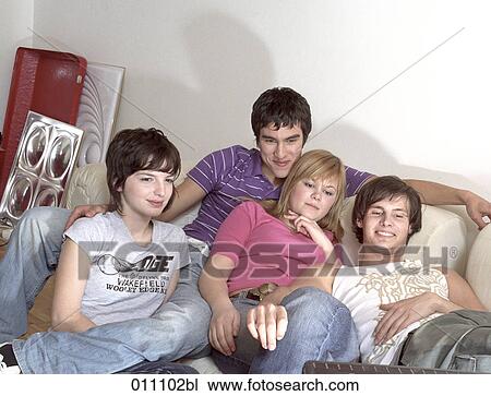 Stock Image - Teenagers watching television. Fotosearch