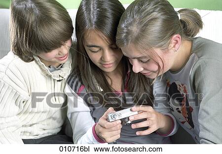 three children looking at display of digital camera View Large Photo Image Stock Image - three children looking at display of digital camera. Fotosearch