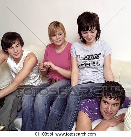 Three teenagers sitting on the back of a friend View Large Photo Image Stock Image - Three teenagers sitting on the back of a friend. Fotosearch