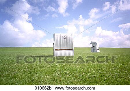 two beach chairs standing on a meadow View Large Photo Image Stock Image - two beach chairs standing on a meadow. Fotosearch