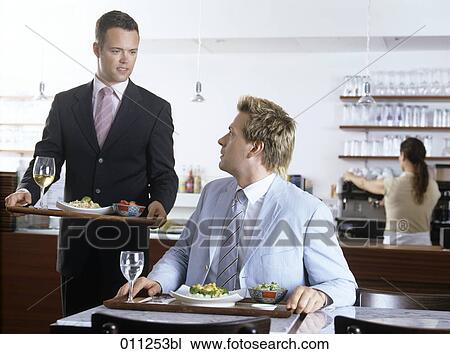 two businessmen meeting in a self-service restaurant View Large Photo Image Stock Image - two businessmen meeting in a self-service restaurant. Fotosearch