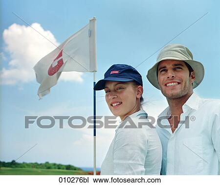two models posing as golfers View Large Photo Image Stock Image - two models posing as golfers. Fotosearch