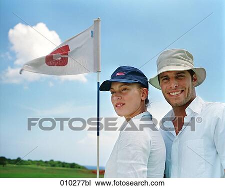 two models posing as golfers View Large Photo Image Stock Image - two models posing as golfers. Fotosearch