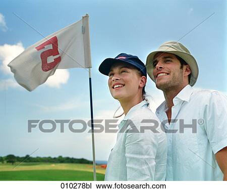 two models posing as golfers View Large Photo Image Stock Image - two models posing as golfers. Fotosearch