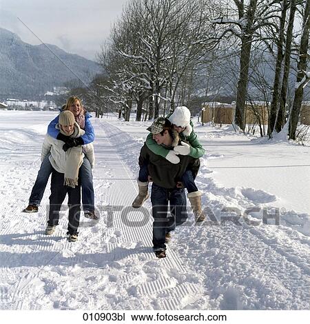 two teenage couples enjoying a day out in the snow View Large Photo Image Stock Image - two teenage couples enjoying a day out in the snow. Fotosearch
