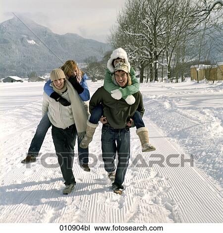 two teenage couples enjoying a day out in the snow View Large Photo Image Stock Image - two teenage couples enjoying a day out in the snow. Fotosearch
