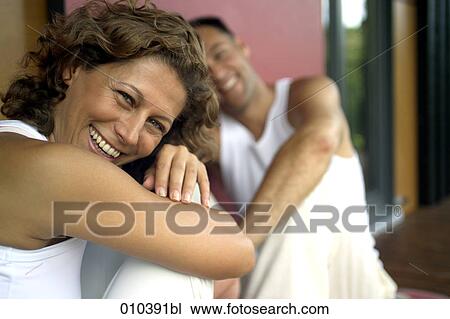 woman smiling on blurred background View Large Photo Image Stock Image - woman smiling on blurred background. Fotosearch