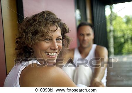 woman smiling on blurred background View Large Photo Image Stock Image - woman smiling on blurred background. Fotosearch