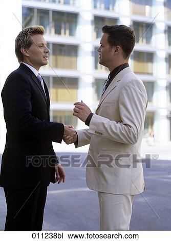 young businessmen shaking hands View Large Photo Image Stock Image - young businessmen shaking hands. Fotosearch