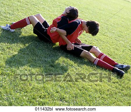 young football players doing stretching exercises View Large Photo Image Stock Image - young football players doing stretching exercises. Fotosearch