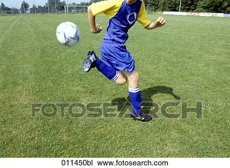 young footballer playing the ball with his backheel View Large Photo Image Stock Image - young footballer playing the ball with his backheel . Fotosearch