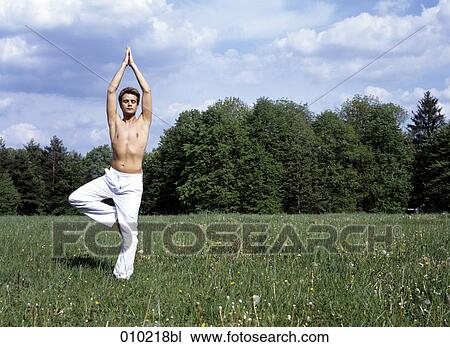 young man (20-25 years) doing wellness training in the park View Large Photo Image Stock Image - young man (20-25 years) doing wellness training in the park. Fotosearch
