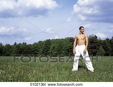 young man doing wellness training in the park View Large Photo Image Stock Image - young man doing wellness training in the park. Fotosearch