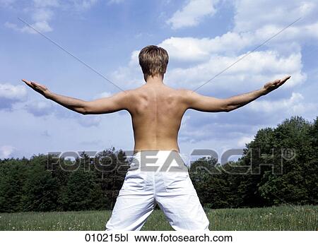 young man doing wellness training in the park View Large Photo Image Stock Image - young man doing wellness training in the park. Fotosearch