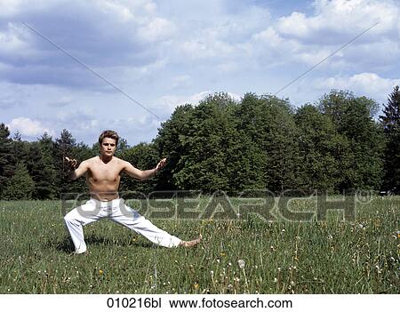 young man doing wellness training in the park View Large Photo Image Stock Image - young man doing wellness training in the park. Fotosearch