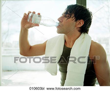 young man drinking water after physical exercise View Large Photo Image Stock Image - young man drinking water after physical exercise. Fotosearch
